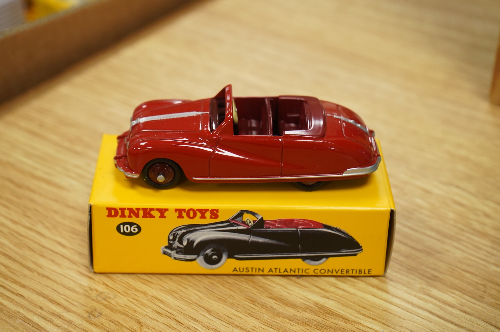 Twenty-two boxed Atlas Dinky Toys, including cars and commercial vehicles, Leyland tankers, a Foden wagon, sports cars, etc.